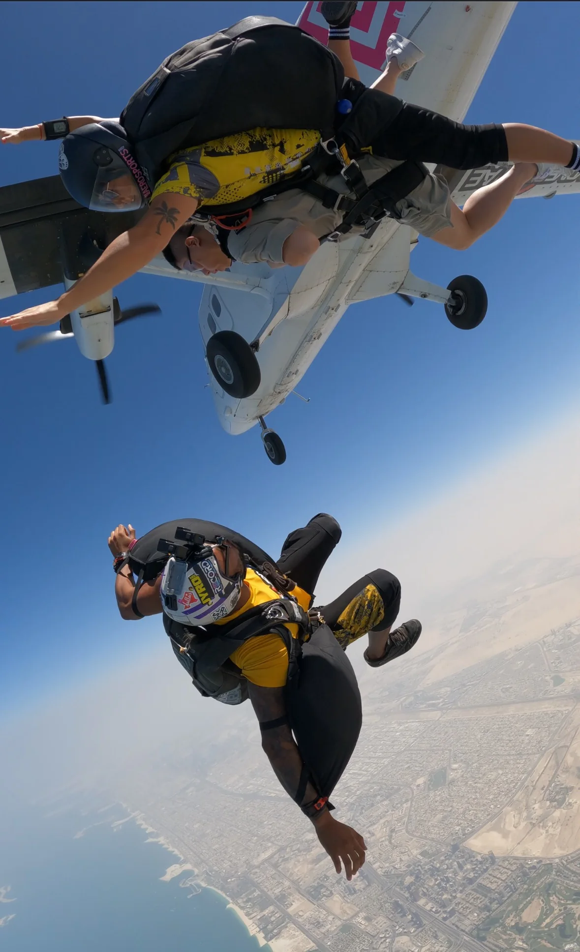 Camera flyer wearing a Skeleton Camera Jacket during a skydive
